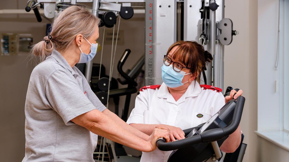 Associate member discussing treatment with a patient